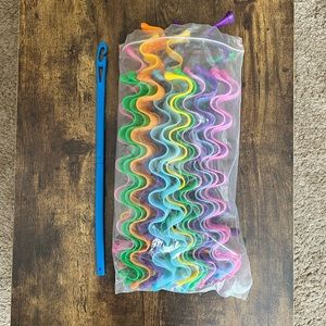 Multi Colored Heatless hair curler tool.